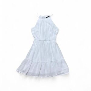 White high neck dress with ruffle hem and key hold button back detail. Size: S